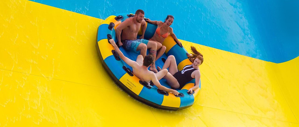 raft-slide Riders zooming down on raft slide